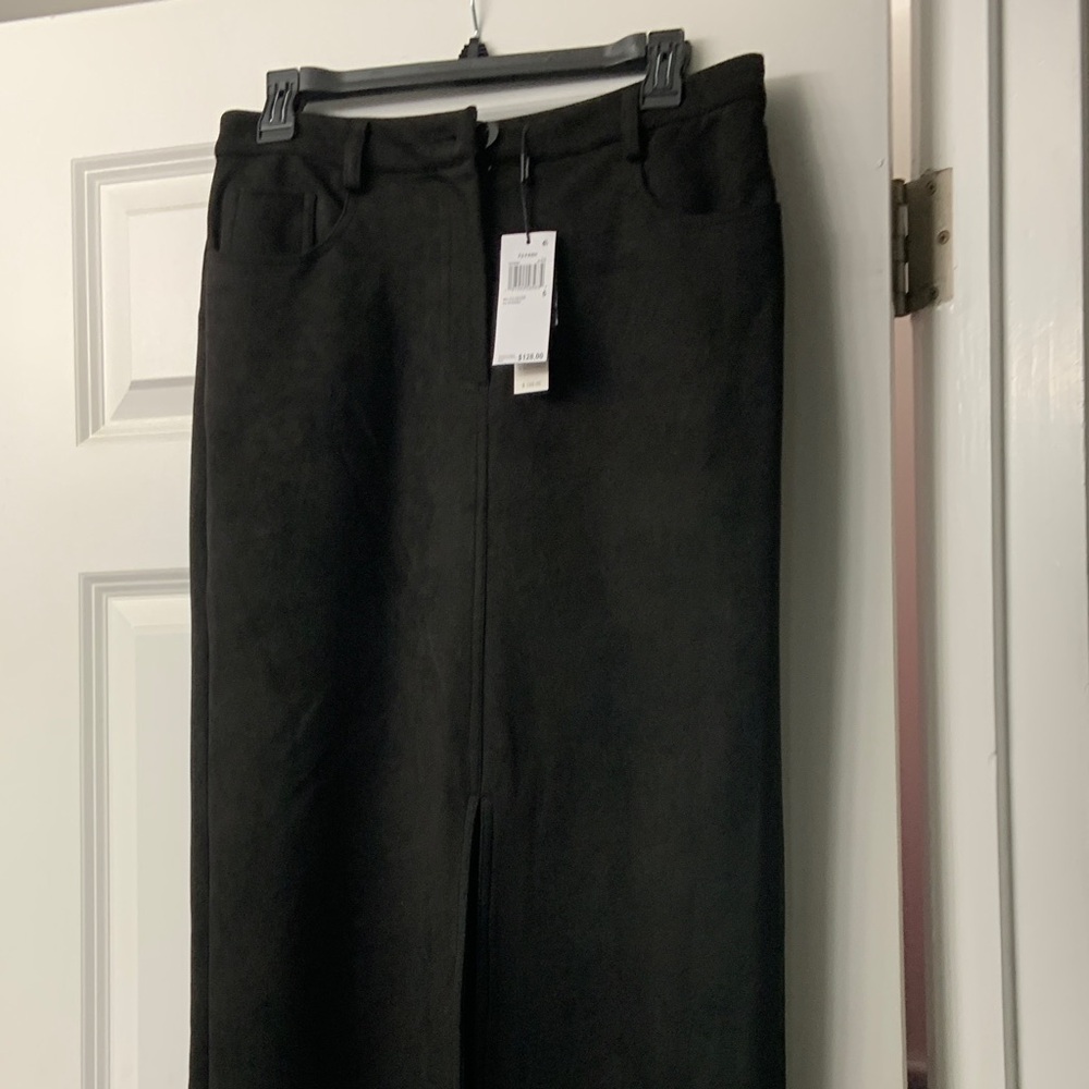 Tahari Black A-Line Skirt. Faux light suede like   33 inches in length.